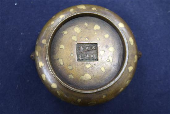 A 17th/18th century Chinese gold splashed bronze censer, Xuande mark, 19th century wood cover, jade finial H.8cm